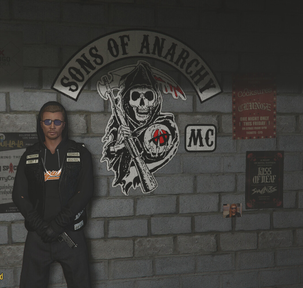 TBRP biker character beside a Sons of Anarchy clubhouse wall in 2021